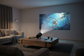 Portable 1080p home projector on a coffee table projecting a movie in a cozy living room